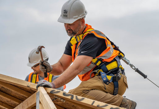 Contractor working on roof of house