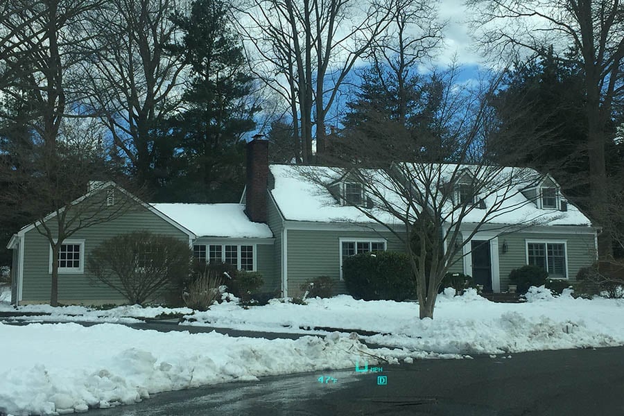 Before renovation - classic Cape Cod house with two bedrooms downstairs and two upstairs