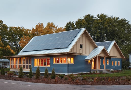 Net Zero Home and Living, House Exterior at Dusk with Solar Panels on Roof