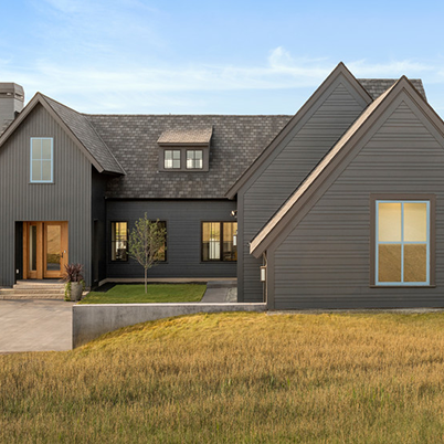 tan home with varied roof lines