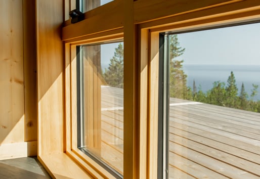 Wood windows overlooking deck and beautiful northern lake view